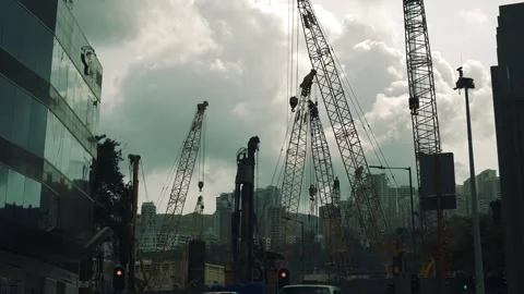 Many cranes working in construction area development area in Hong Kong Stock Footage 245486500