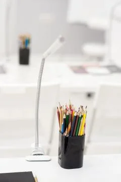 Many crayons with different colors. Back to school. Colored pencils in an gla Stock Photos