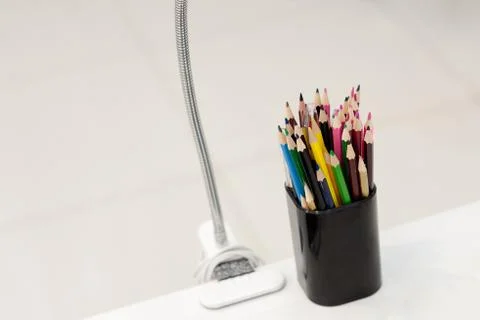 Many crayons with different colors. Back to school. Colored pencils in an gla Stock Photos