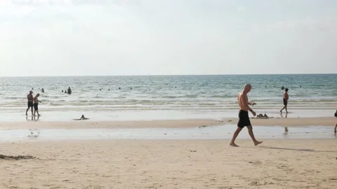 Many crowded of people take vacation relax on beach under sunshine day in p.. Stock Footage 236120406