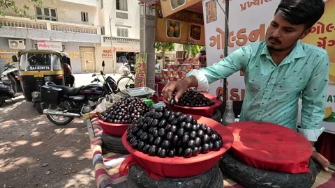 Many customers are buying java plum at java plum shop Stock Footage 277322827