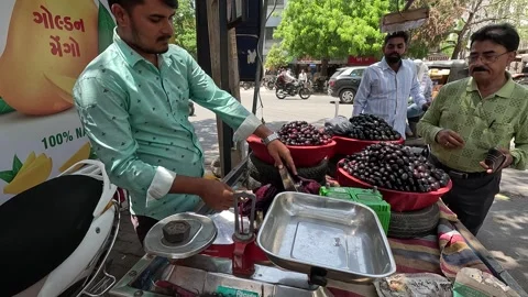 Many customers are buying java plum at java plum shop Stock Footage 277322846