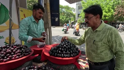 Many customers are buying java plum at java plum shop Stock Footage 277322874