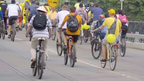 Many cyclists ride on the streets of city and park. Bike ride to the city day Stock Footage 90381253