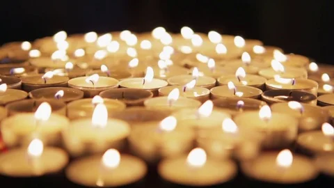 Many decorative candles burning in the dark Stock Footage 79037963