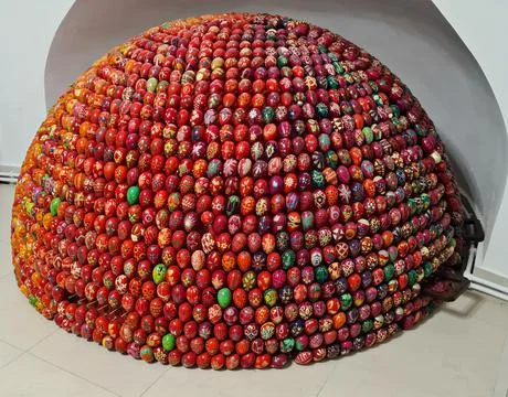 Many decorative Easter eggs painted with beautiful bright colors are stacked  Stock Photos