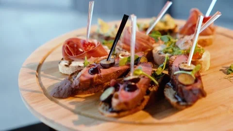 Many delicious dishes on the festive table, close-up Stock Footage 304516122