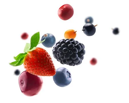 Many different berries in the form of a frame on a white background Stock Photos