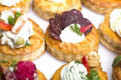 Many different canapes on a white background Stock Photos