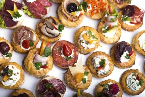 Many different canapes on a white background Stock Photos
