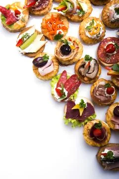 Many different canapes on a white background Foto stock