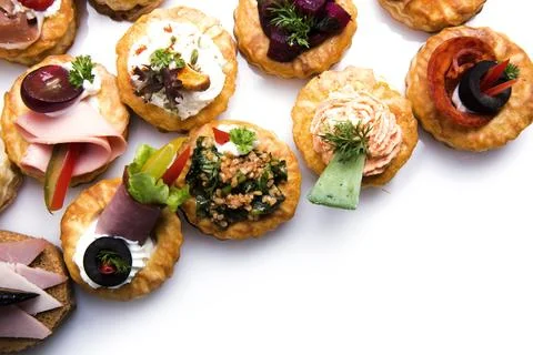 Many different canapes on a white background Stock-Fotos