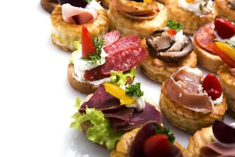 Many different canapes on a white background Stock Photos