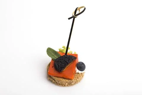 Many different canapes on a white background Stock Photos