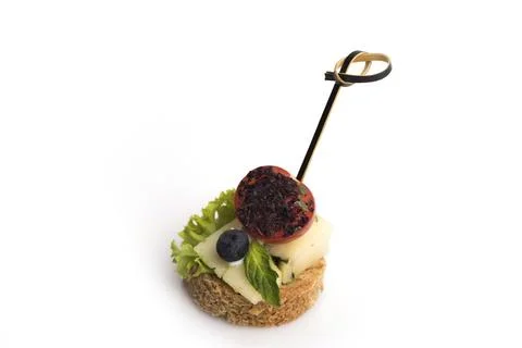 Many different canapes on a white background Stock Photos
