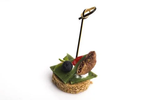 Many different canapes on a white background Stock Photos