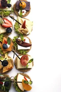 Many different canapes on a white background Foto stock