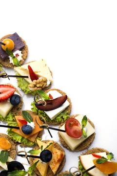 Many different canapes on a white background Stock Photos