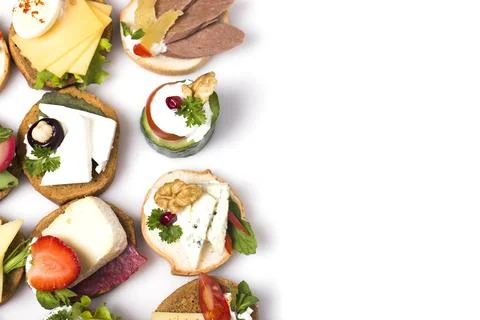 Many different canapes on a white background Stock Photos