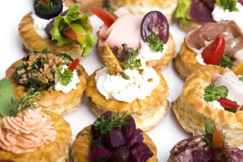 Many different canapes on a white background Foto stock