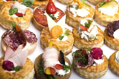 Many different canapes on a white background Stock Photos