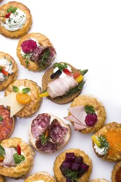 Many different canapes on a white background Foto stock