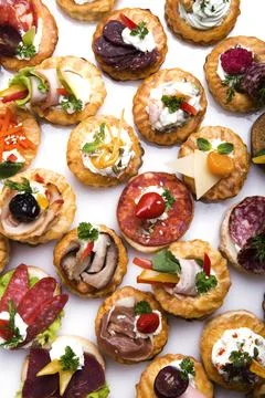 Many different canapes on a white background Foto stock