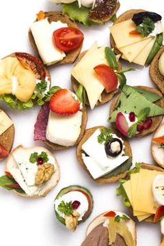 Many different canapes on a white background Stock Photos