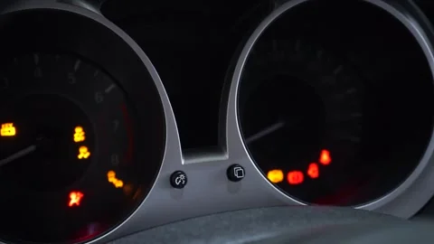 Many different car dashboard lights with warning lamps illuminated.  Video stock 169029691