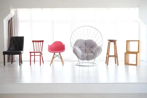 Many different chairs of different colors Stock Photos