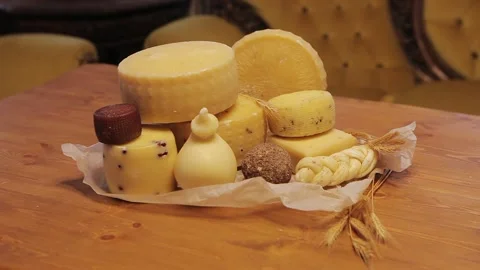 Many different cheeses are on the table. Stock Footage 130656374