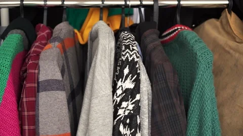 Many different clothes hanging in the wardrobe Stock Footage 156762426