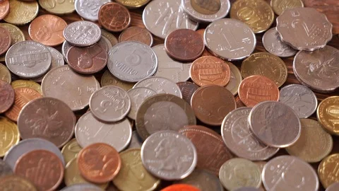 Many different coins on the table. Background of coins. Video stock 107789809