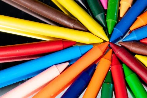 Many different colored Crayons  reflected on black Stock Photos