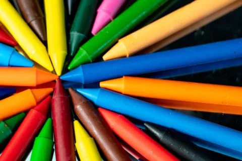 Many different colored Crayons  reflected on black Stock Photos