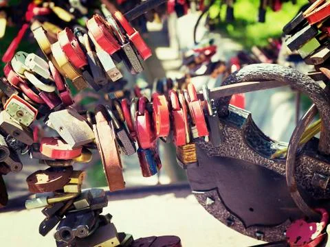 Many different colored padlocks hung in a row Stock Photos