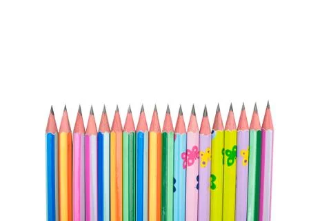 Many different colored wood pencil crayons placed on a white background Stock Photos