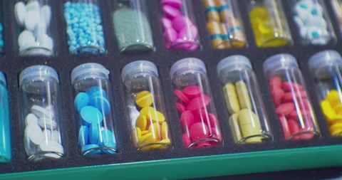 Many different drugs of different shapes and colors packaged in identical 스톡 동영상 229085064