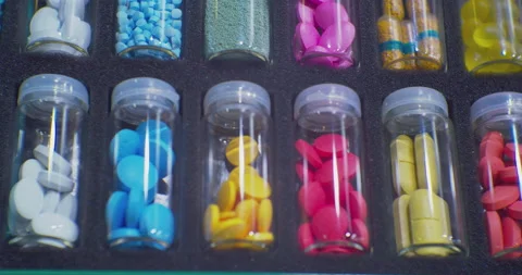 Many different drugs of different shapes and colors packaged in identical 스톡 동영상 229087630