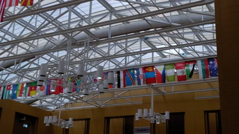 Many different flags of countries of the world are hung in big hall. Stock Footage 313817107