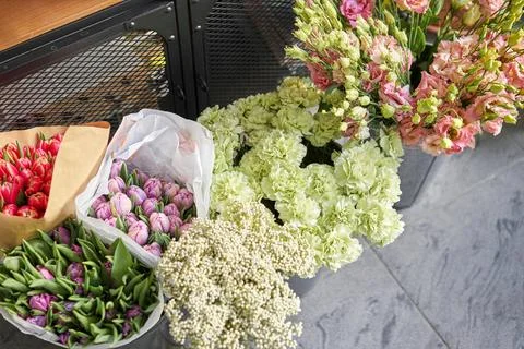 Many different flowers on Showcase. Background of mix of flowers. Beautiful Stock Photos