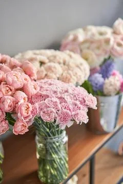 Many different flowers on Showcase. Background of mix of flowers. Beautiful Stock Photos