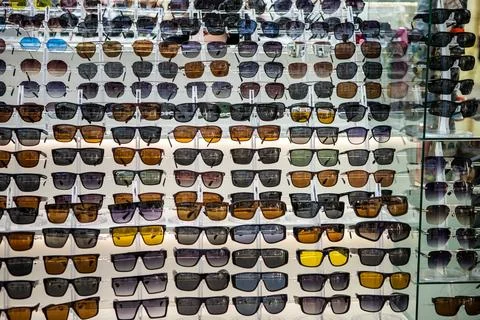 Many different full-screen protective sunglasses. hot season. Stock Photos