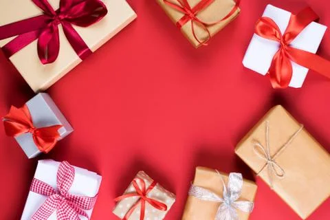 Many different gift boxes on red. Stock Photos