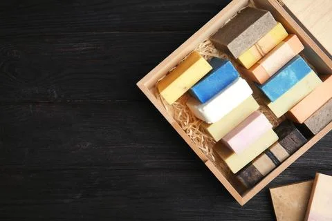 Many different handmade soap bars in wooden box and space for text on table,  스톡 사진