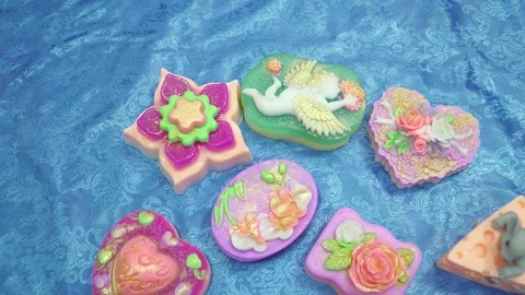 Many different handmade soaps on the table closeup Video stock 74362001