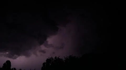 Many different lightning flashes on a summer night over the city landscape. Stock Footage 132971692