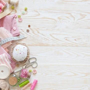 Many different materials for needlework and sewing. A girl / woman is drinking Stock Photos