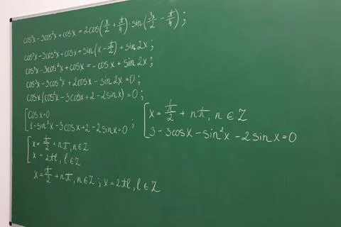 Many different math formulas written on green chalkboard Stock Photos