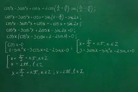 Many different math formulas written on green chalkboard Stock Photos